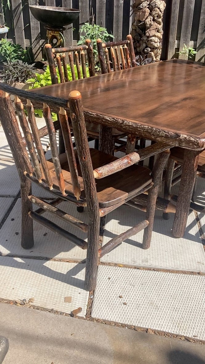 hand  made log table and 6 chairs 