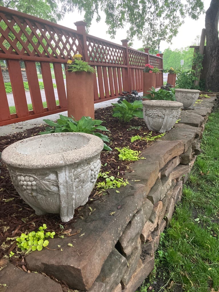 3 matching cement urns 