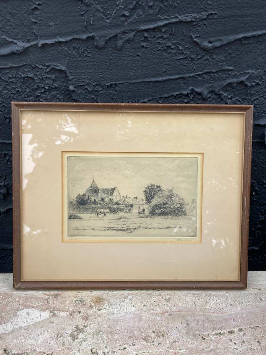 Framed etching of cow and English scene 