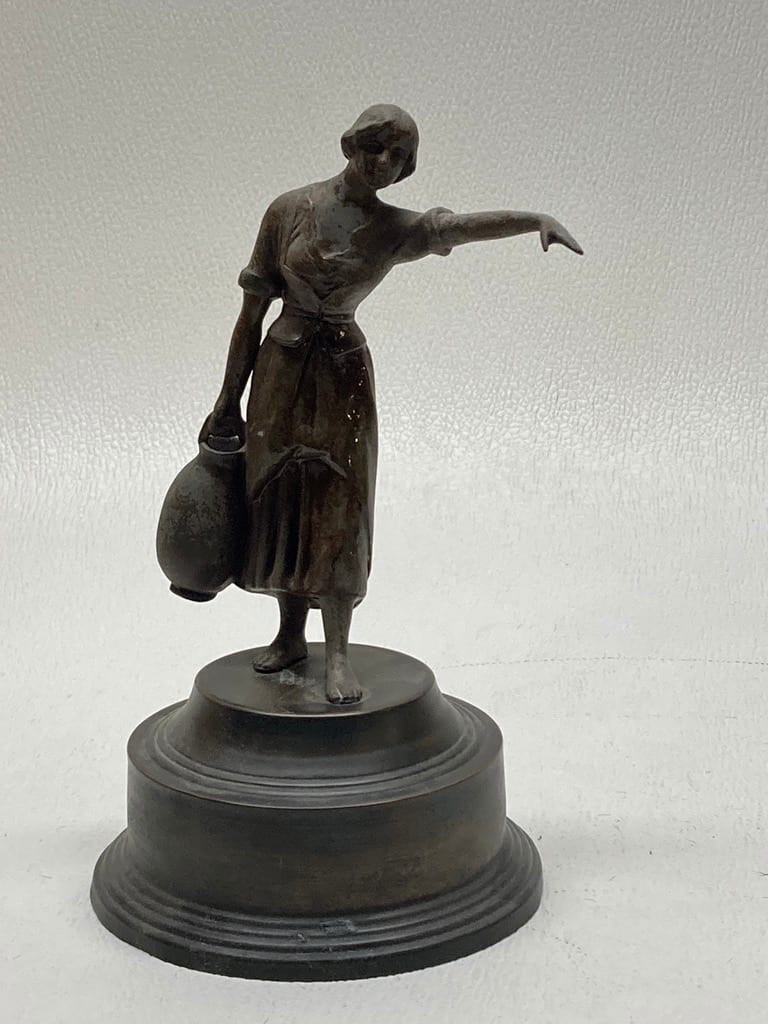 Sculptural woman carrying water 