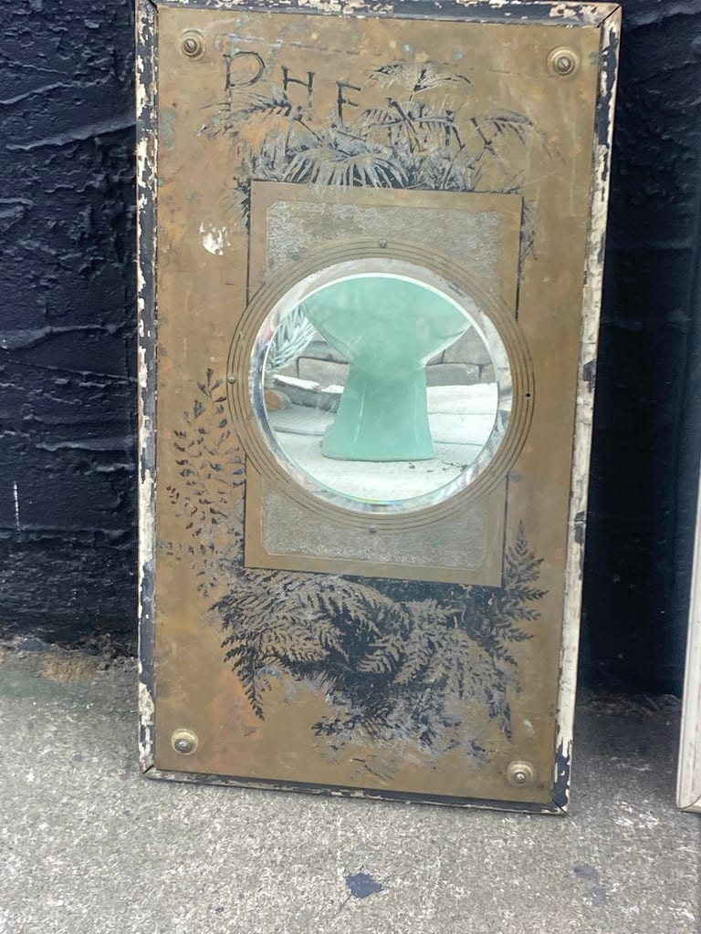 Brass "Phenix " mirror with wood backing 