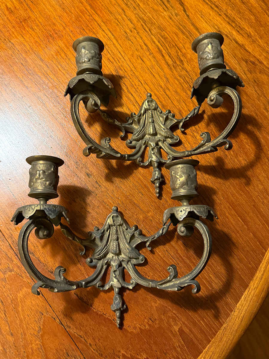 Pair of ornate brass wall mounted candelabra 