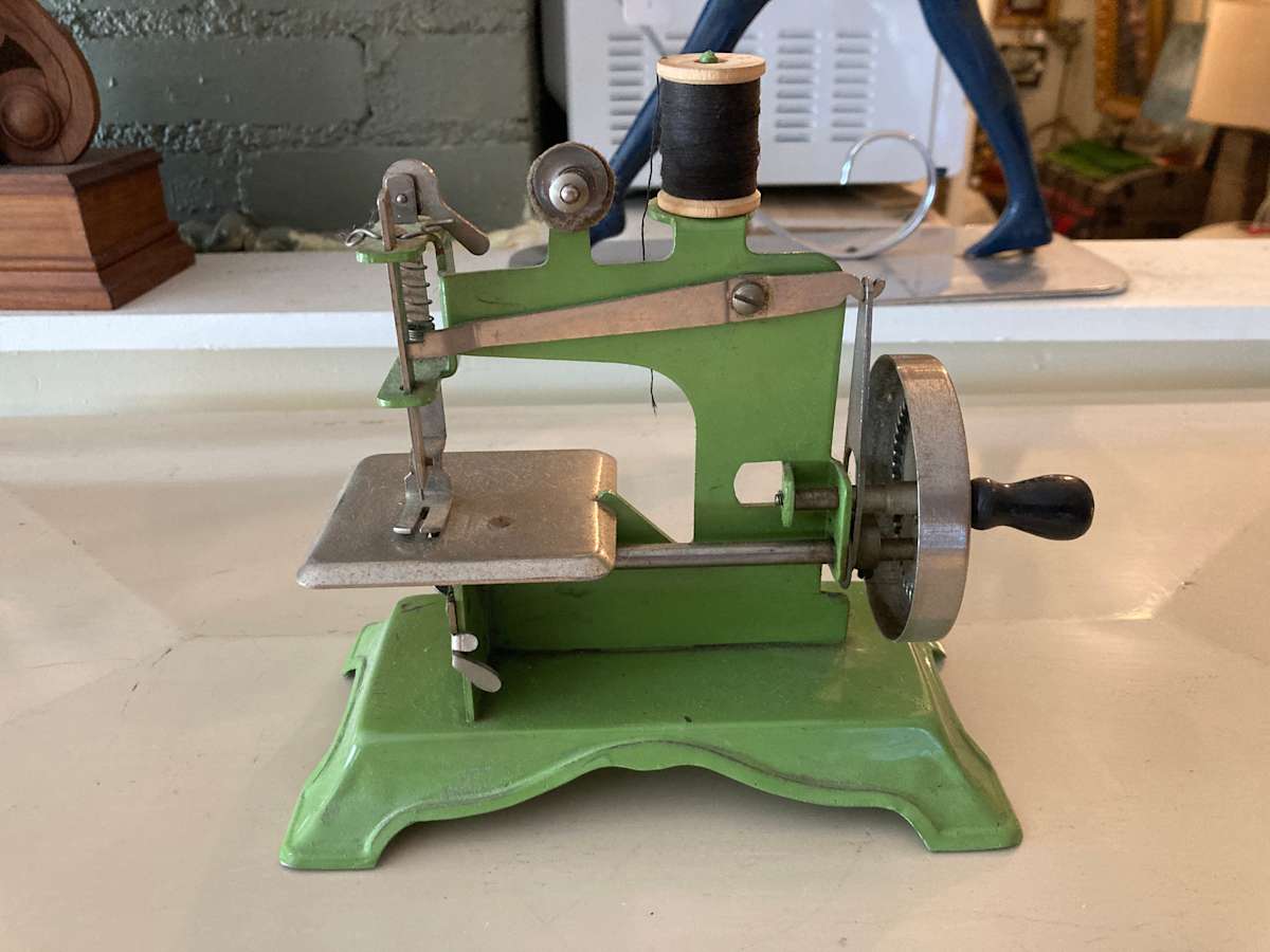 vintage green toy sewing machine 