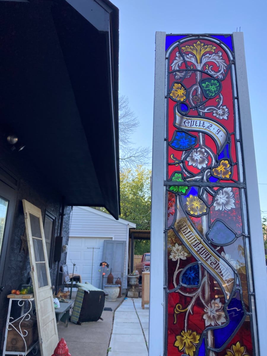 Narrow hand painted long narrow stained glass windows from the