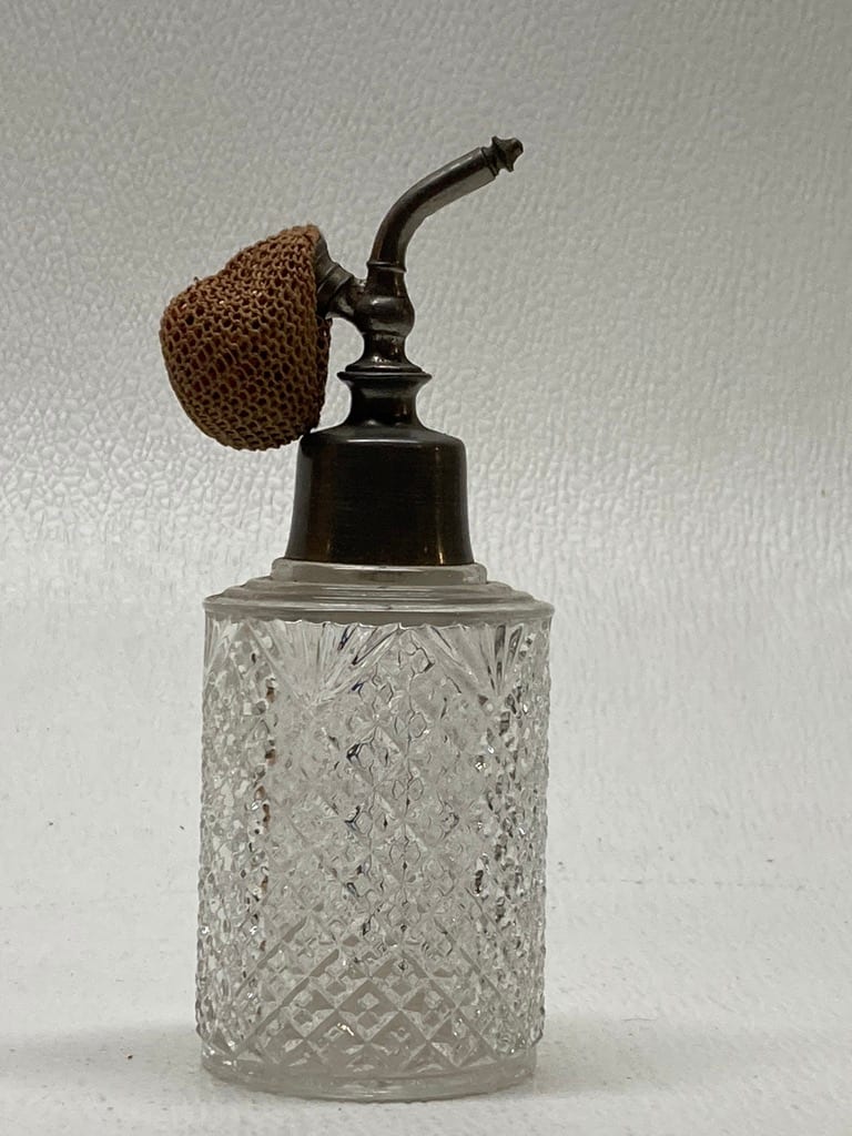 Clear perfume bottle with pewter top 