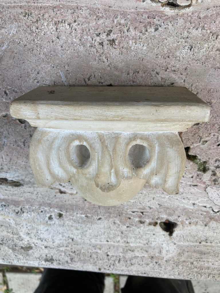 small decorative plaster carved shelf 