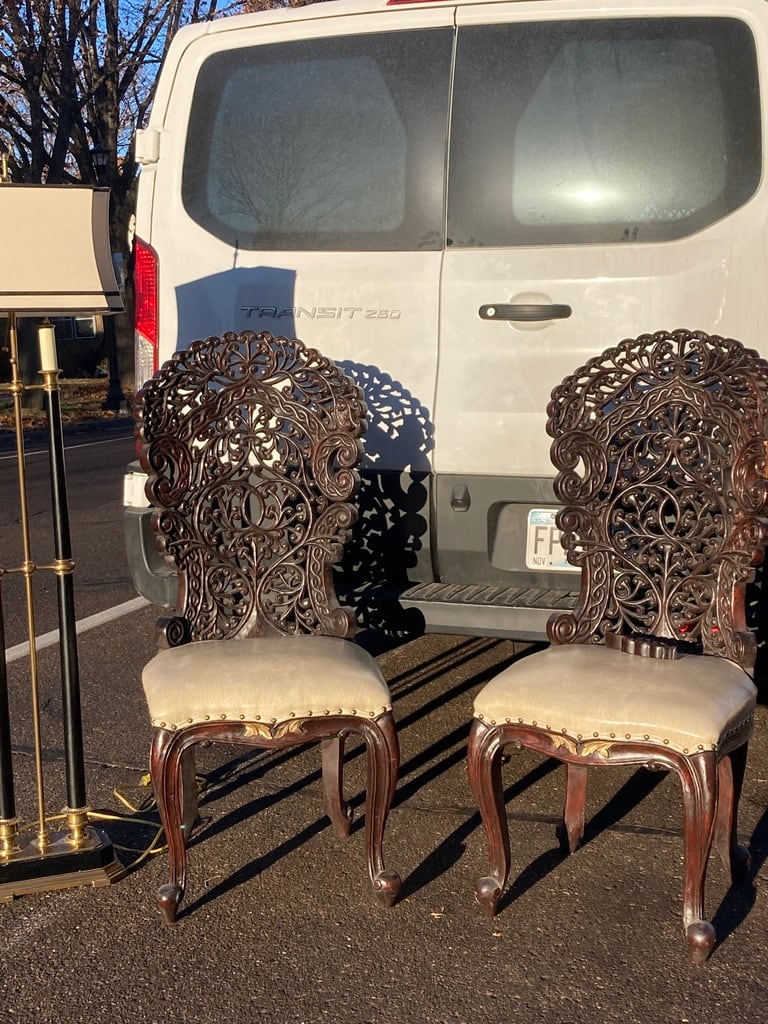 Pair of heavily carved chairs 