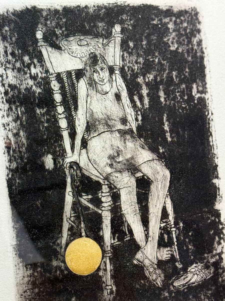 Framed etching of girl in chair 