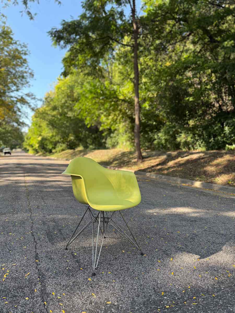 Yellow Herman Miller shell arm chair 