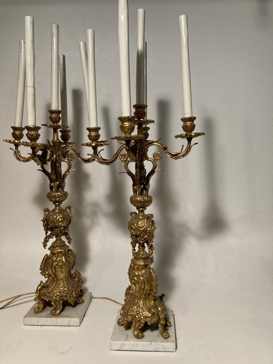 Pair of tall electrified ornate candleabra with marble bases 