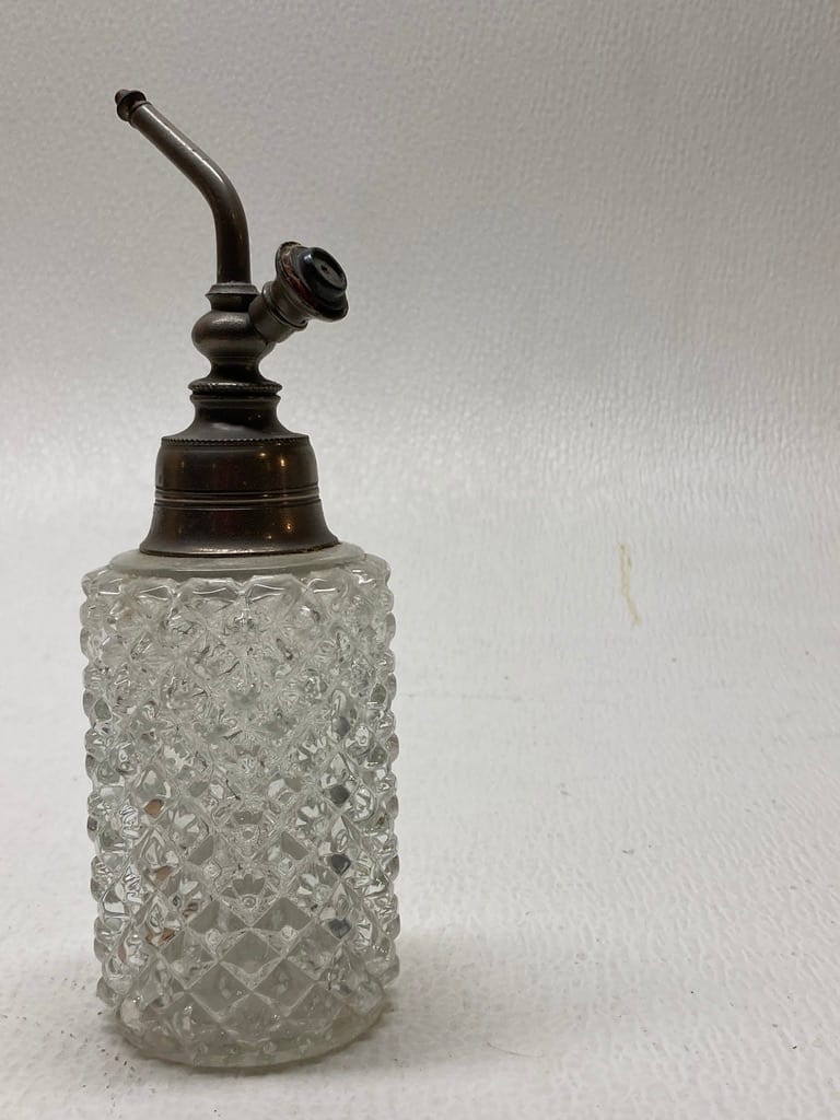 Clear perfume bottle with pewter top 