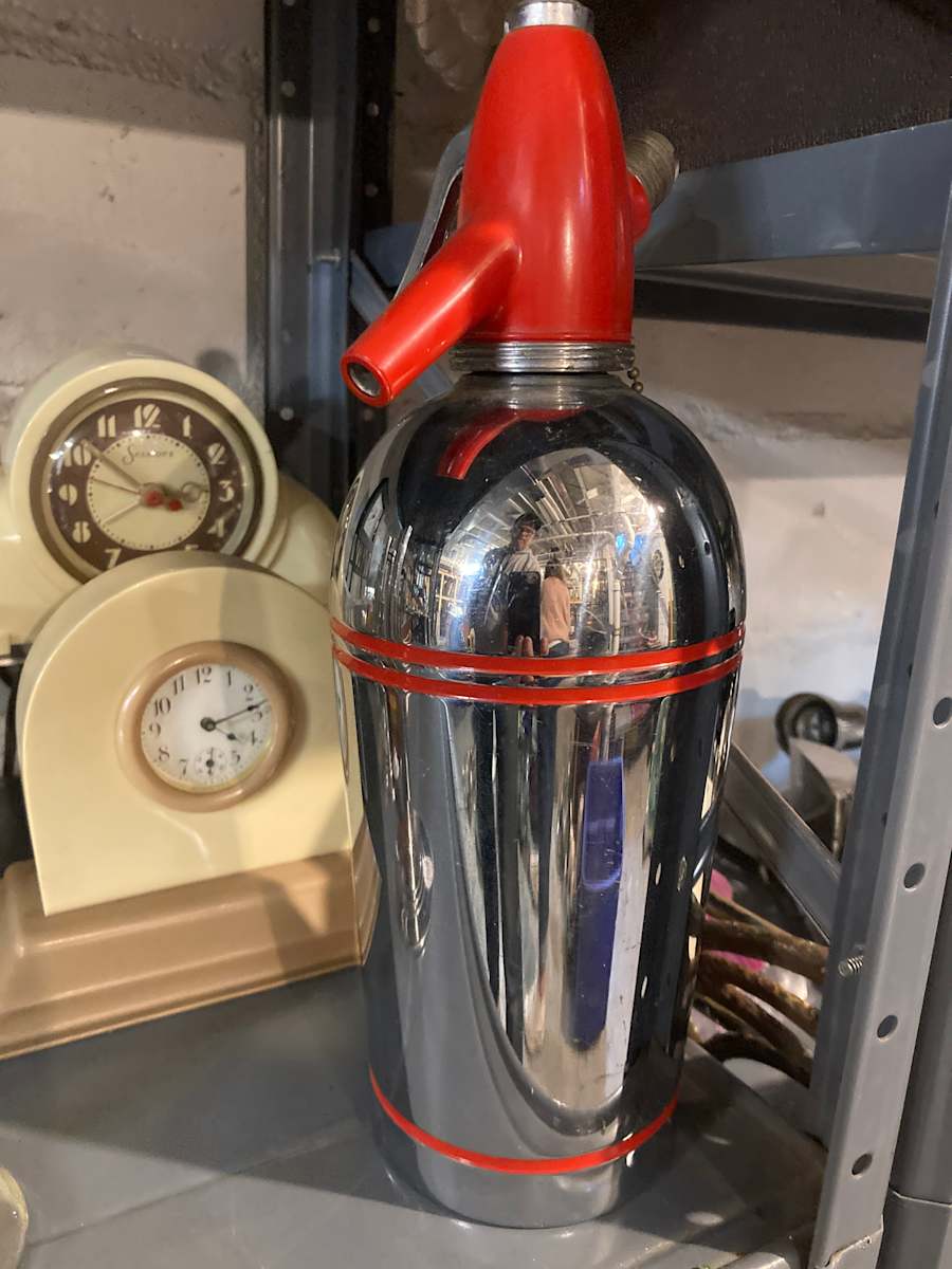 Chrome seltzer bottle with red top 