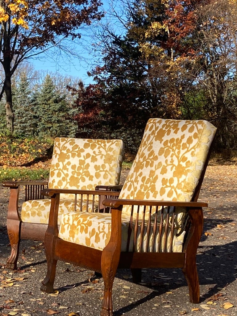 Pair of carved claw foot morris chairs 