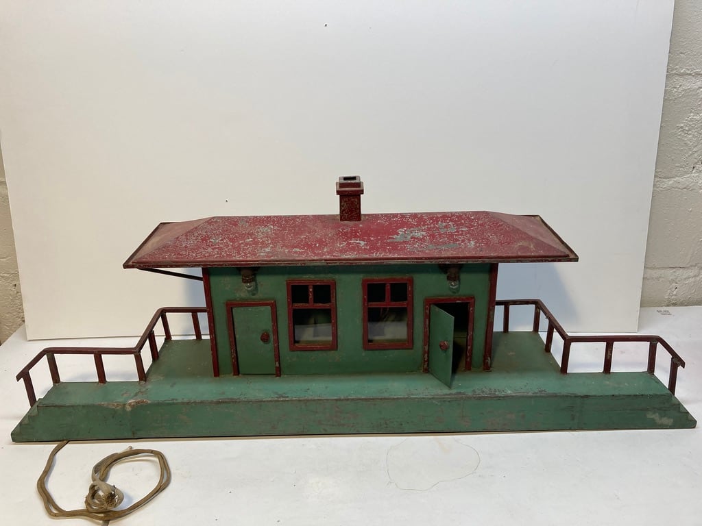 Folk art metal painted depot with lights 