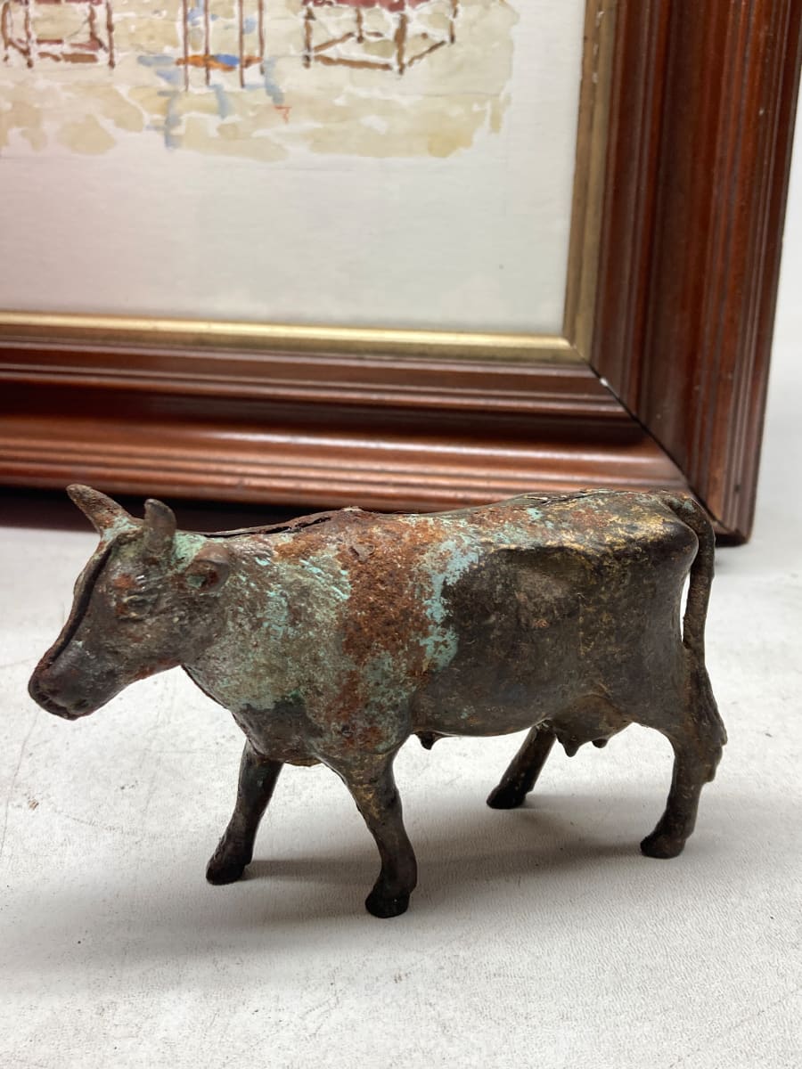 Cast iron cow penny bank 