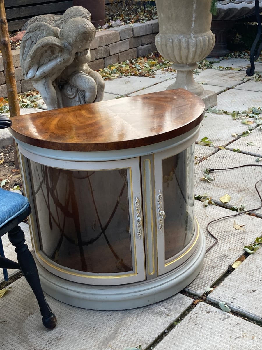 half round low glass lit cabinet 