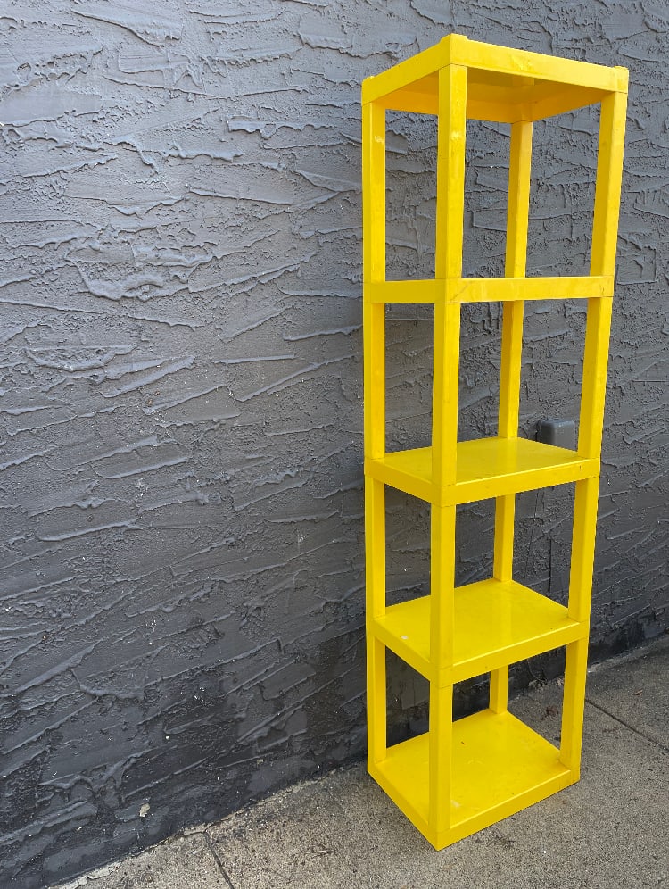 Yellow modular plastic tower display 