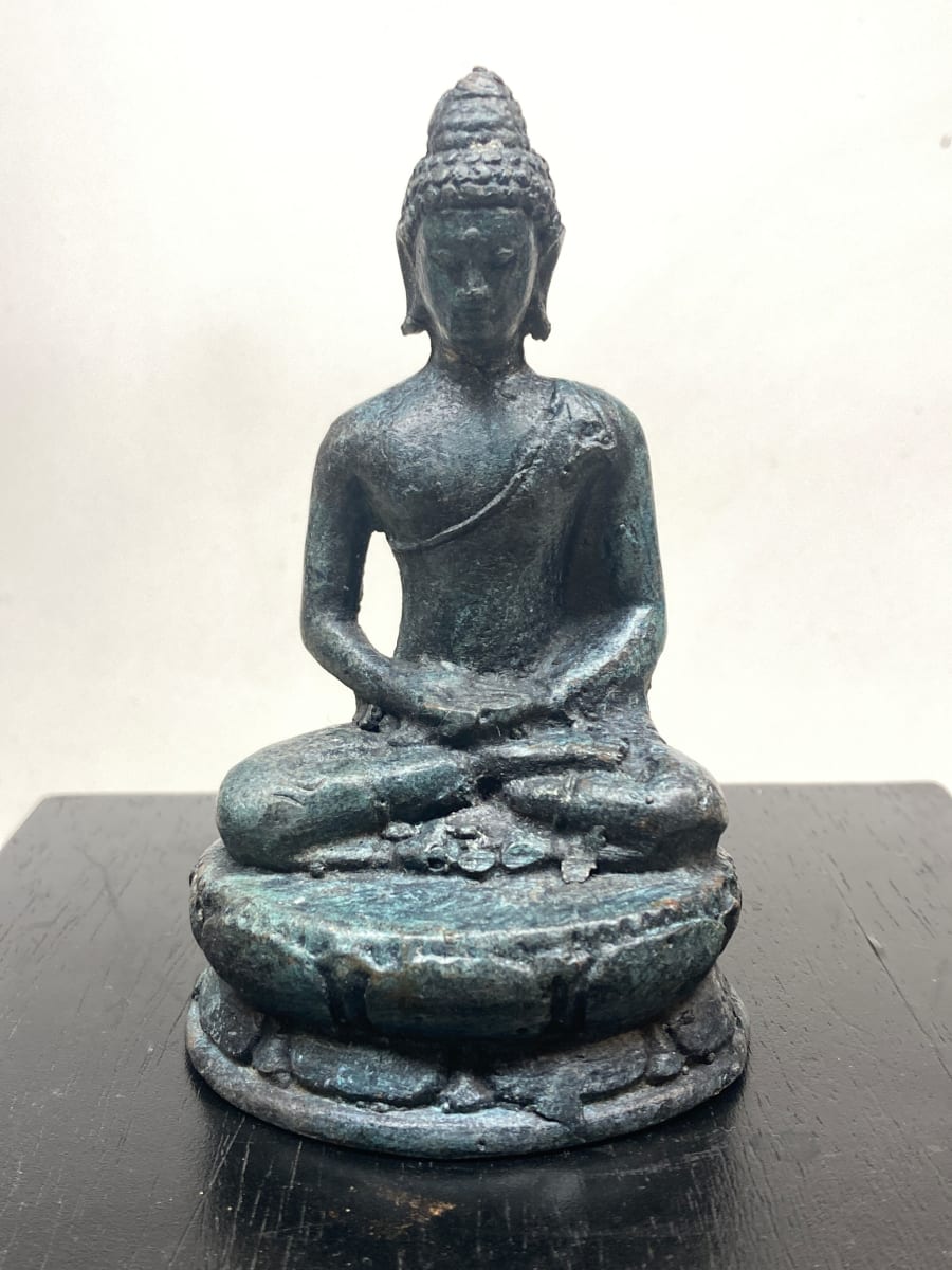 small metal buddha figure 