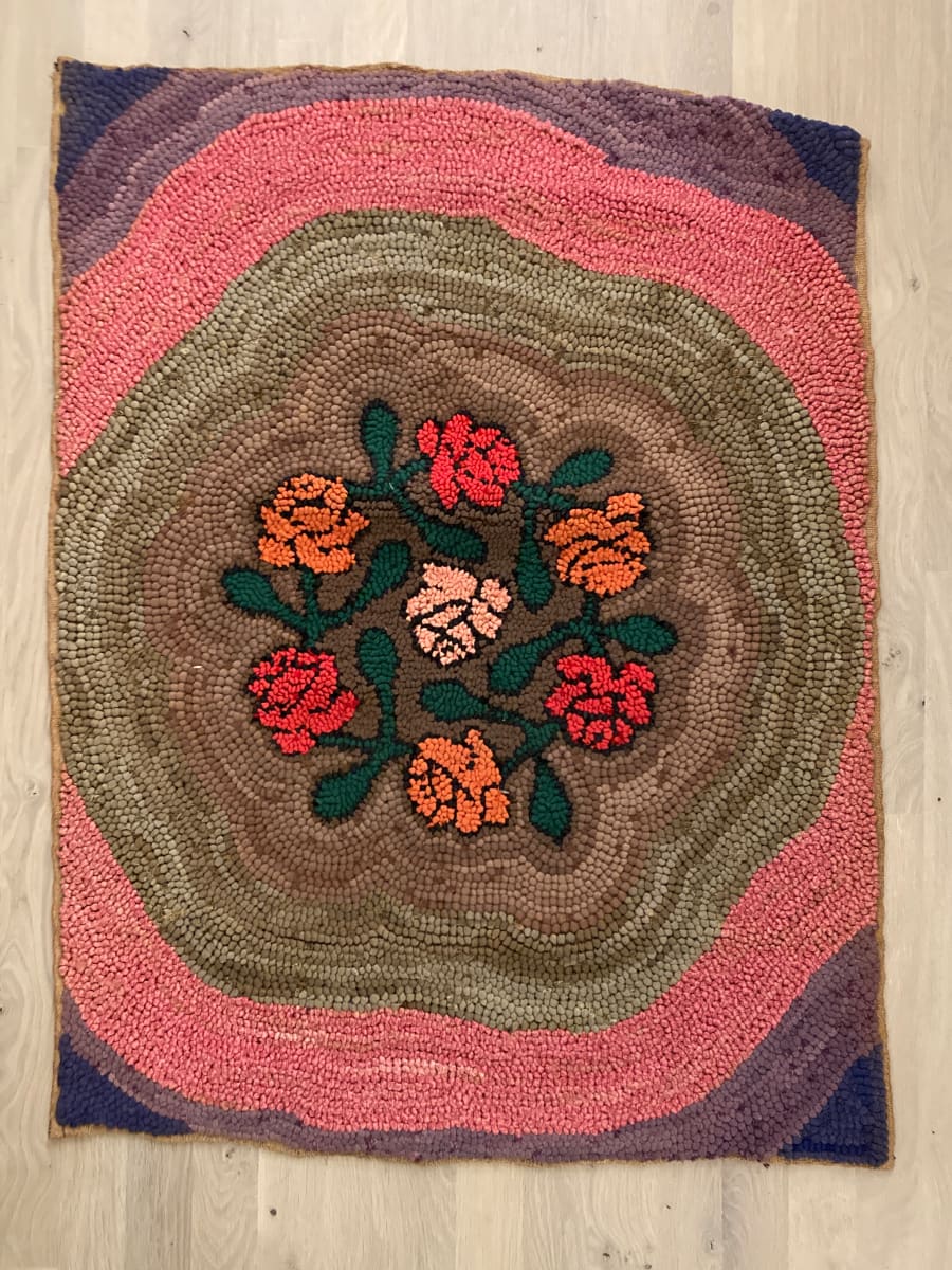 Rose patterned vintage hooked rug 
