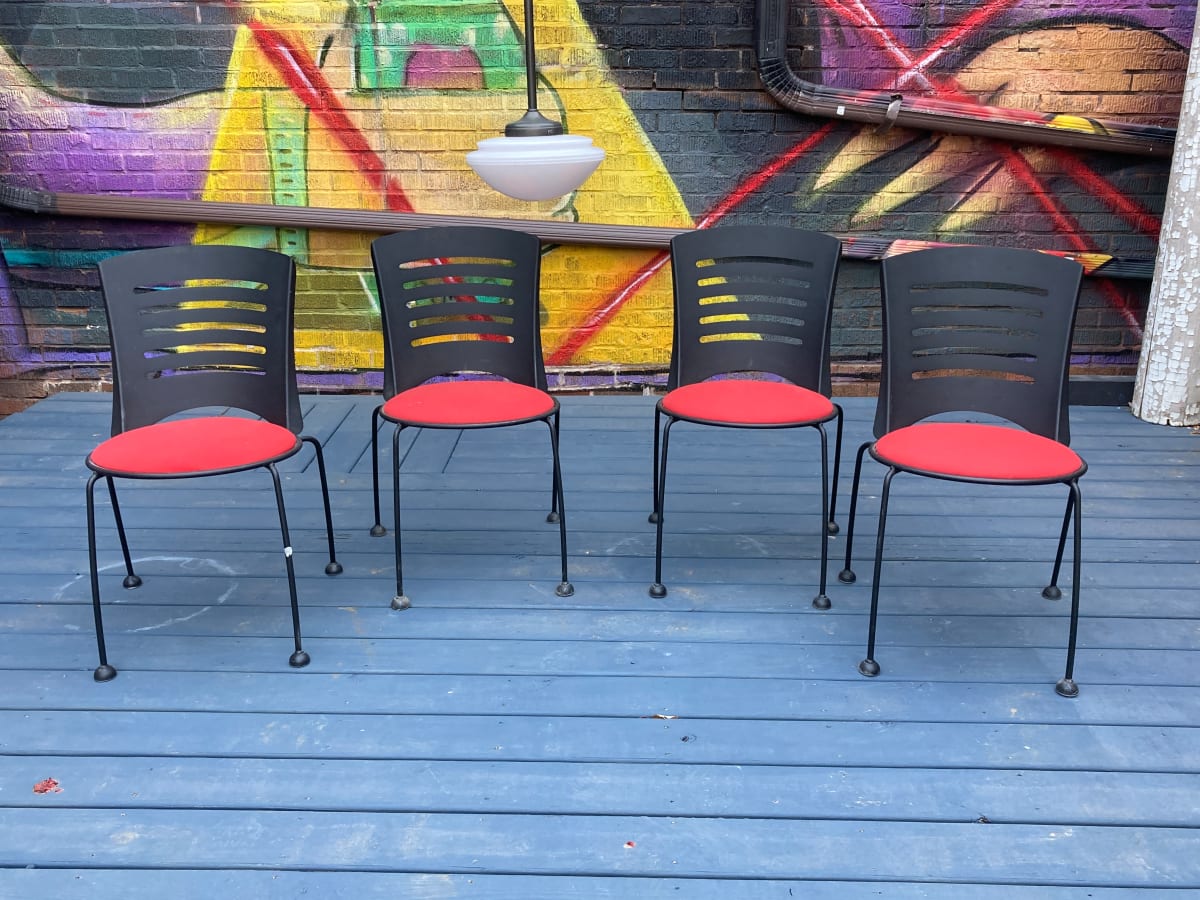 Post modern metal chairs with red seats 
