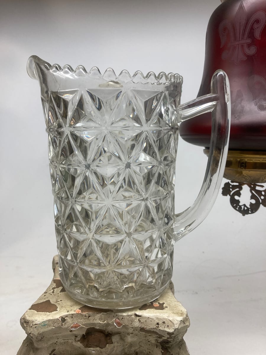 clear glass water pitcher with geometric pattern 