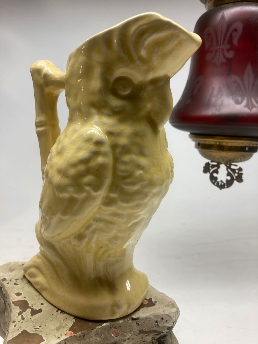 Yellow pottery parrot water pitcher 