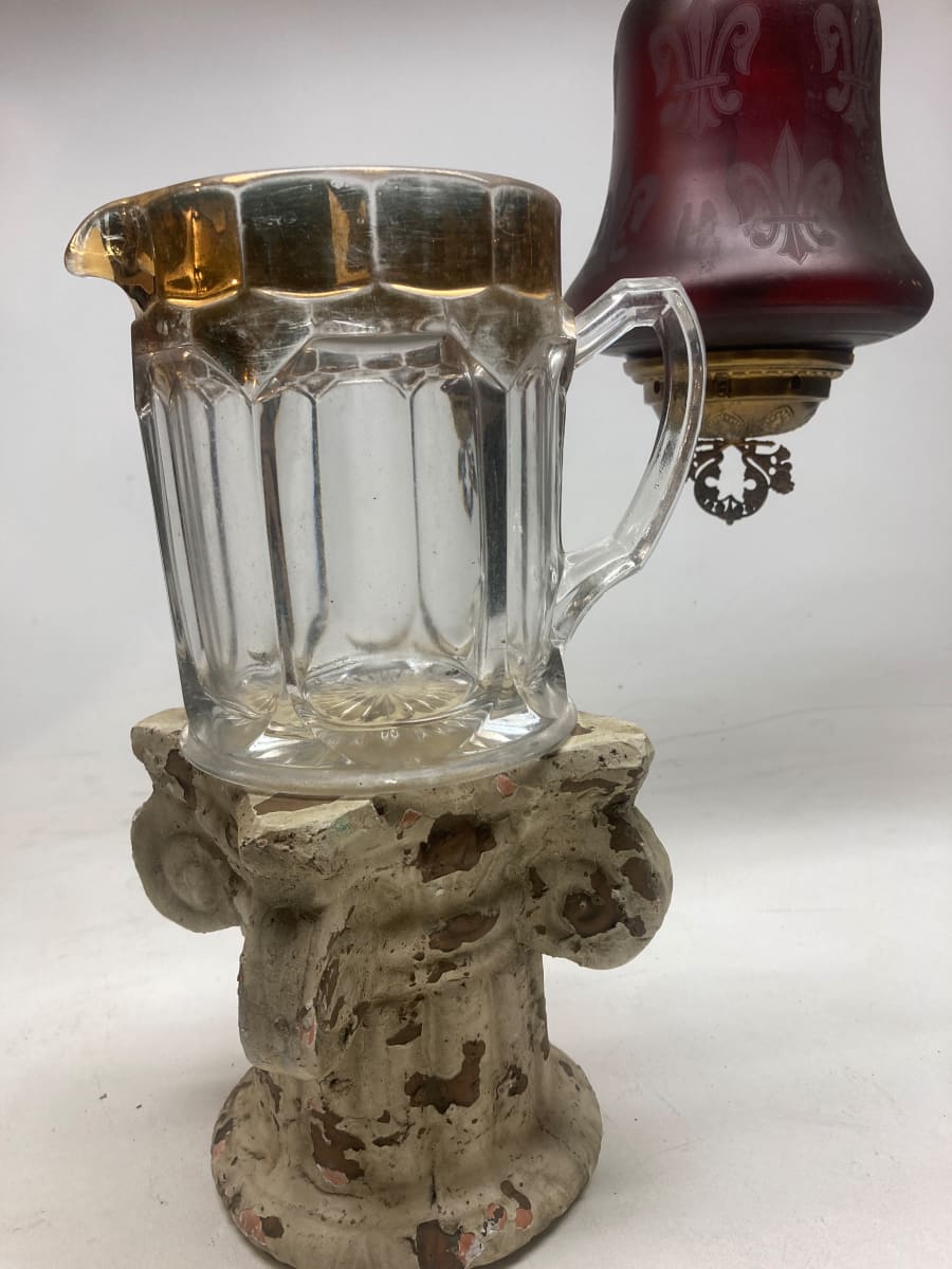 clear glass water pitcher with gold lip 