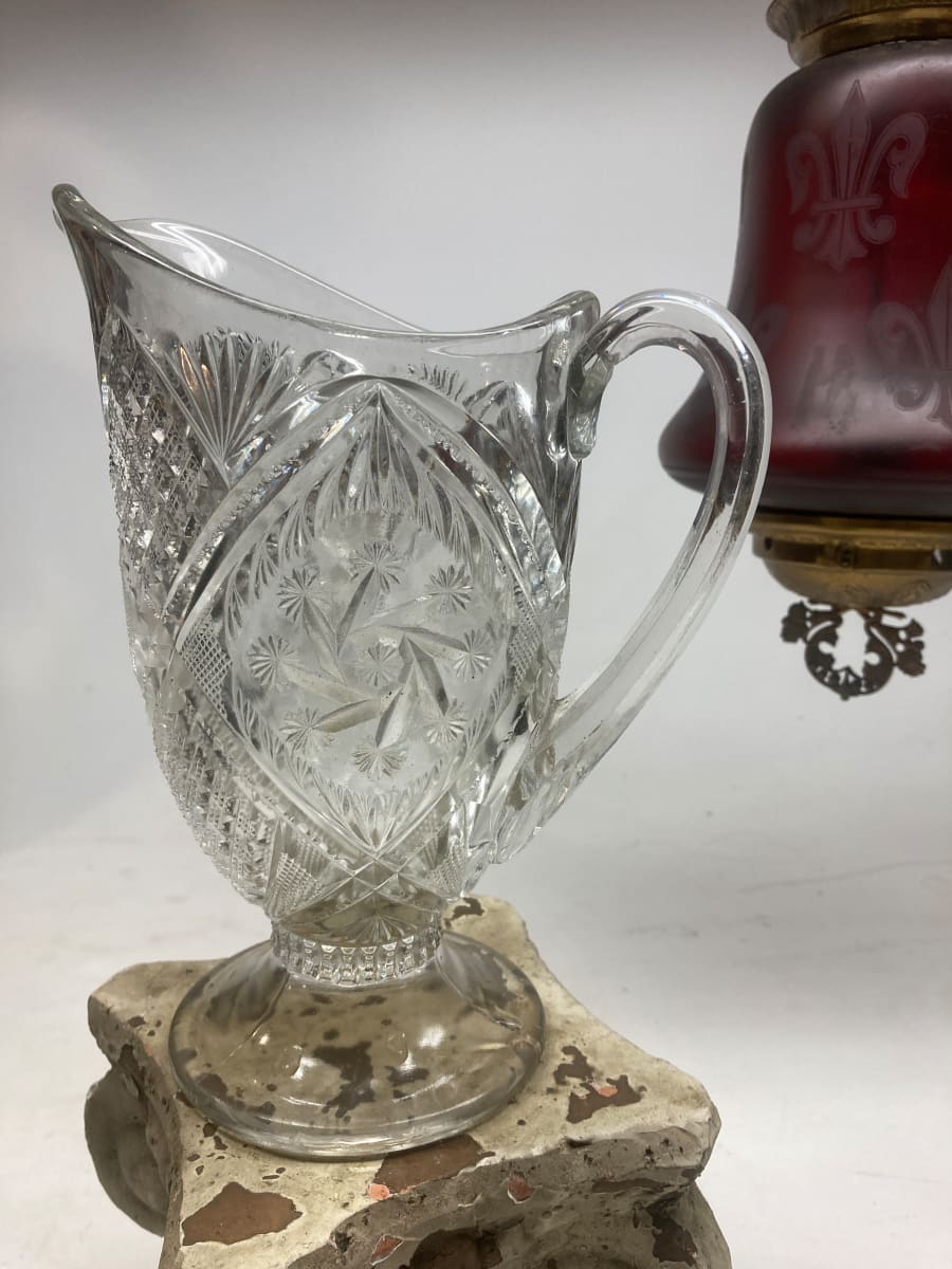 clear glass ornate water pitcher 