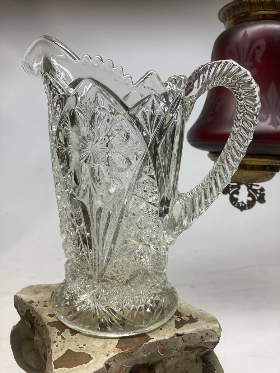 clear glass ornate water pitcher 