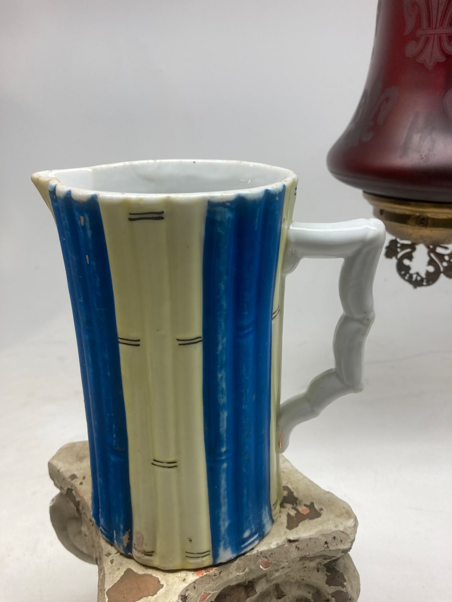 blue and yellow pottery pitcher 