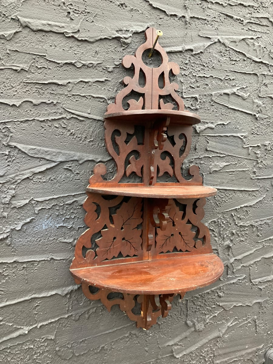 Rounded walnut carved wall shelf 