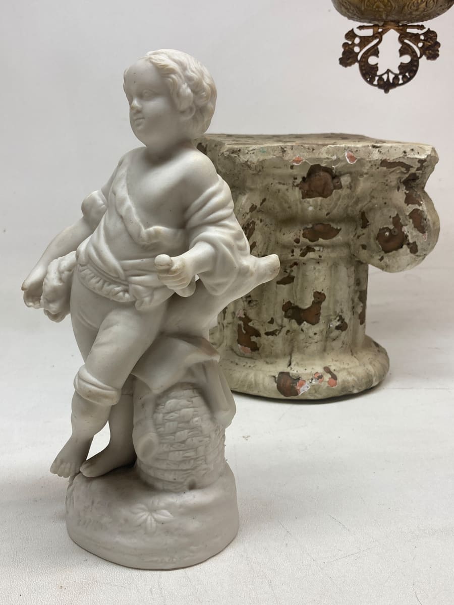 Parian porcelain leaning child figure 