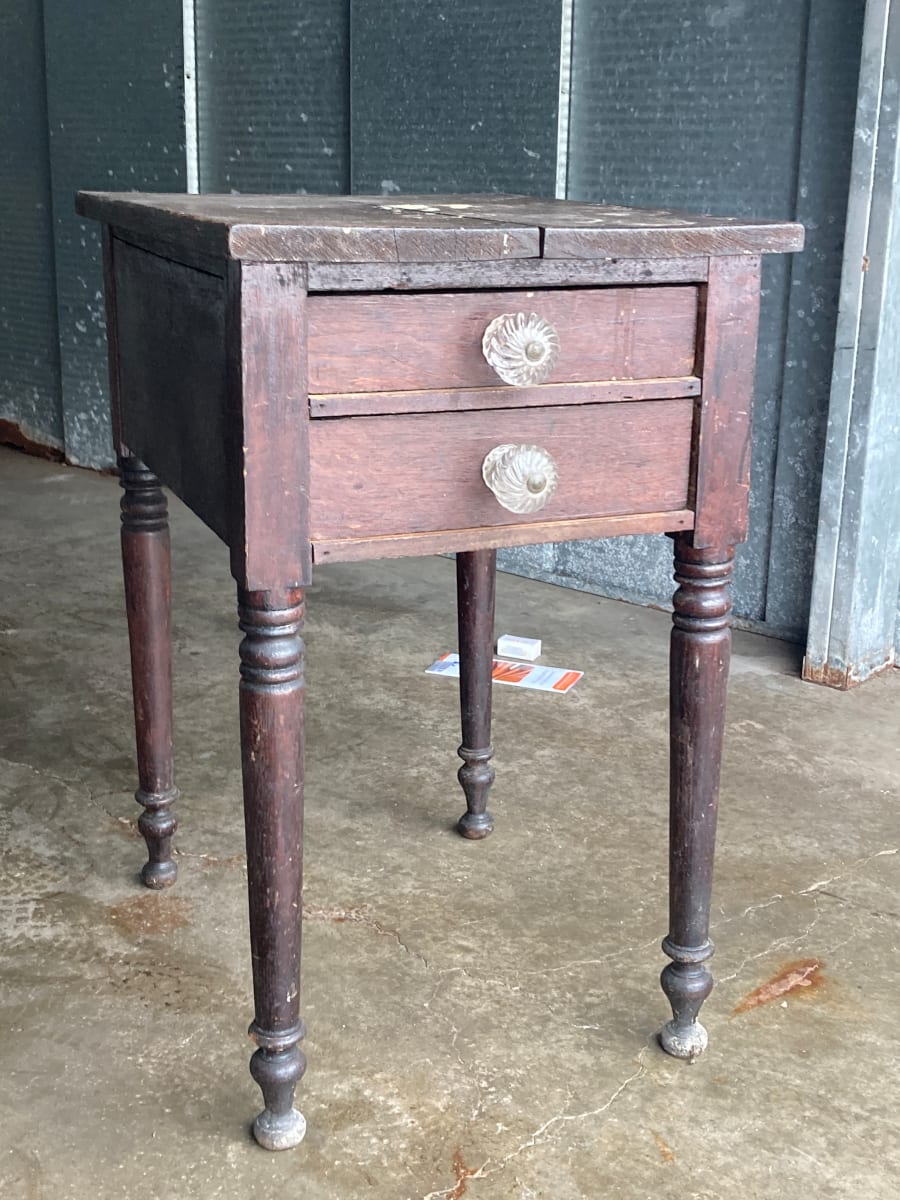 Early two drawer side table with glass handles 