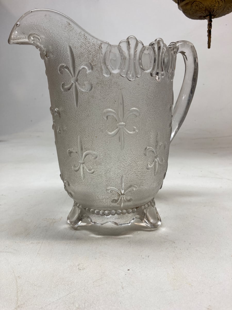 EAPG clear glass pitcher with Fleur De Lis pattern 