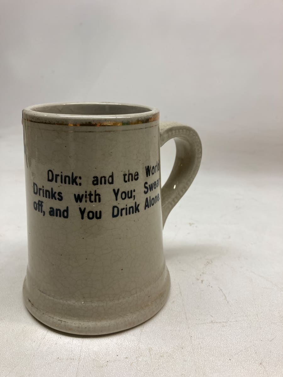 pottery mug with drinking motto 