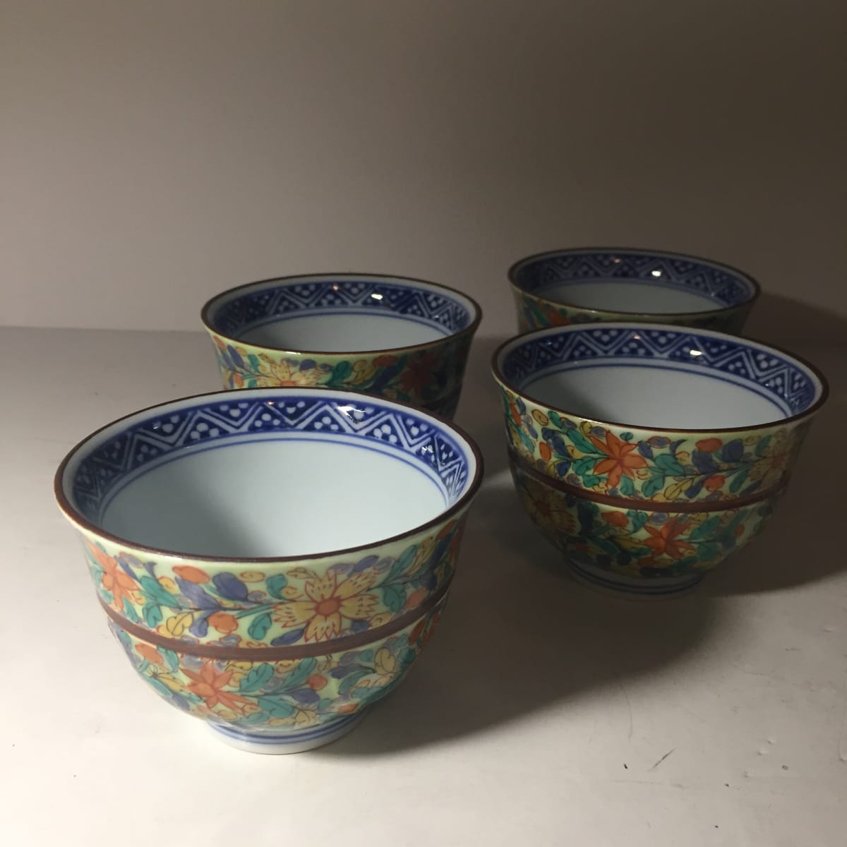 4 matching asian saki cups 