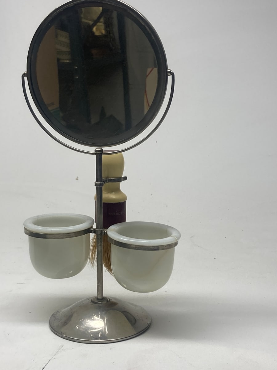 silver table top shaving mirror stand with accessories from the