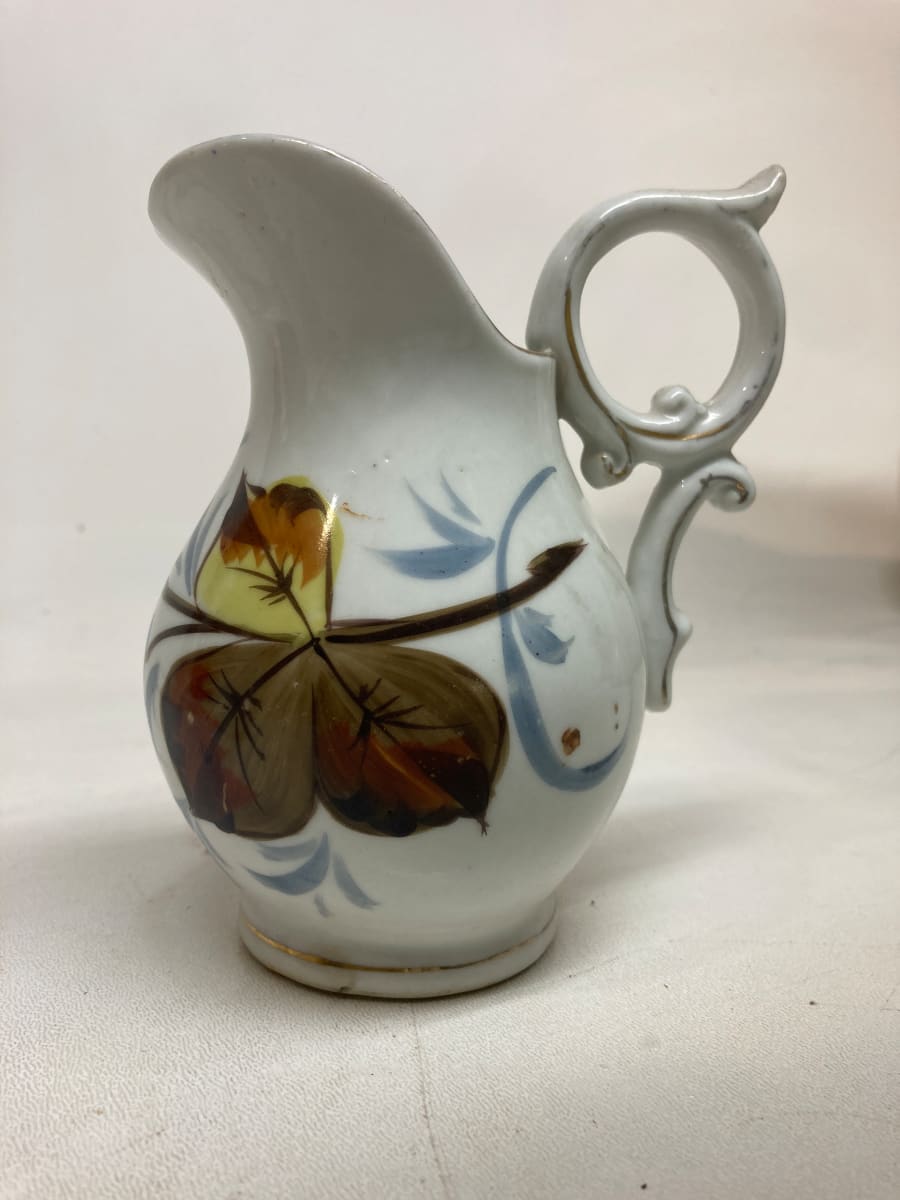 small porcelain pitcher with hand decorated fruit 