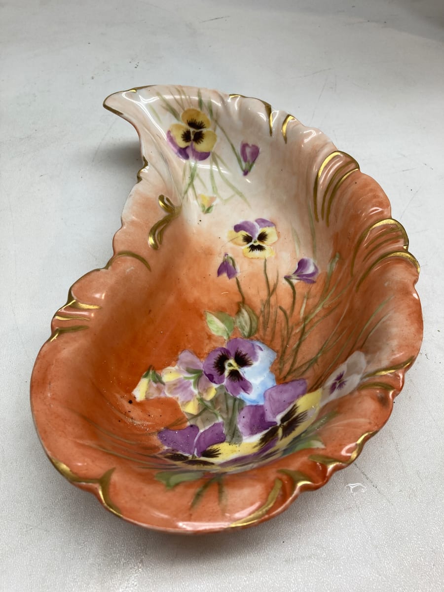 hand decorated orange low comma shaped dish 