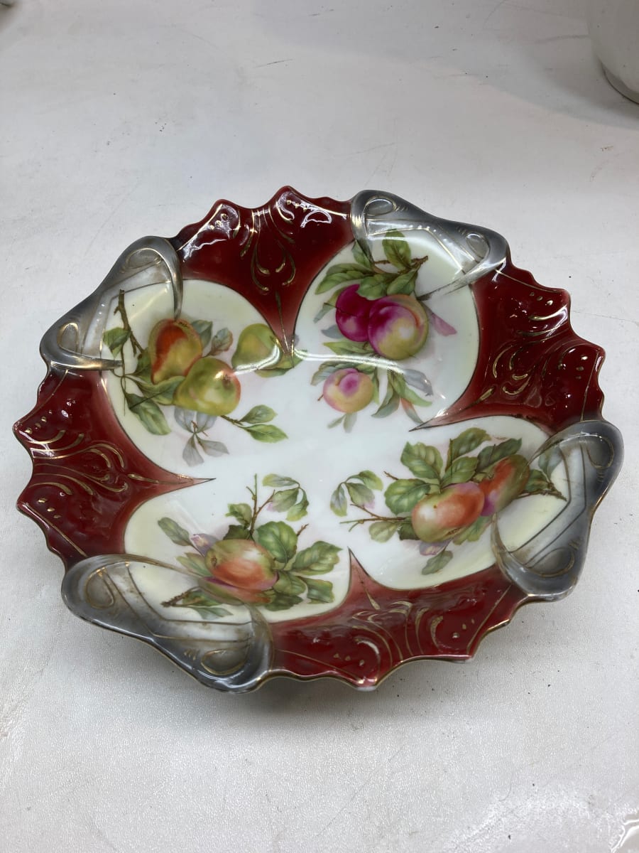 Hand decorated serving plate with red and white background with fruit decoration 