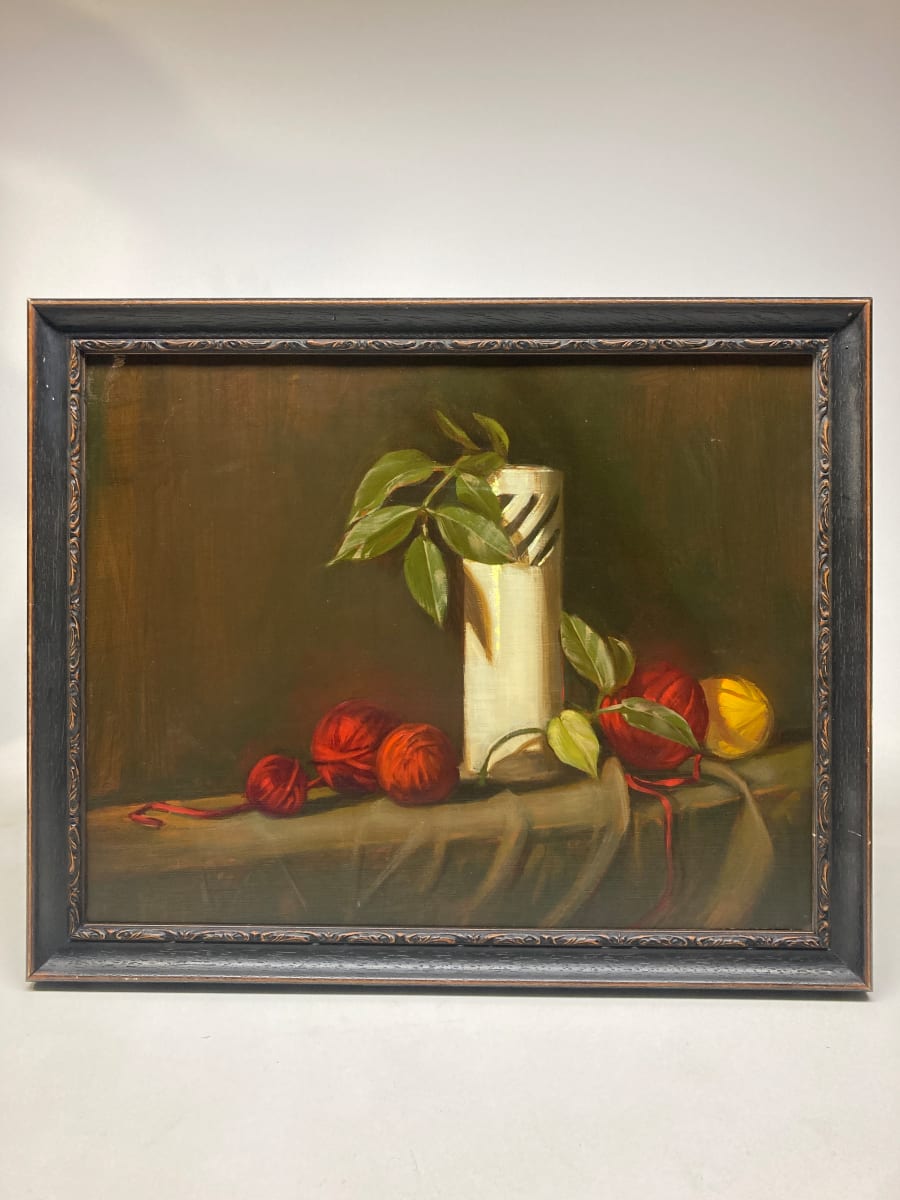 Framed still life with white vase and yarn 