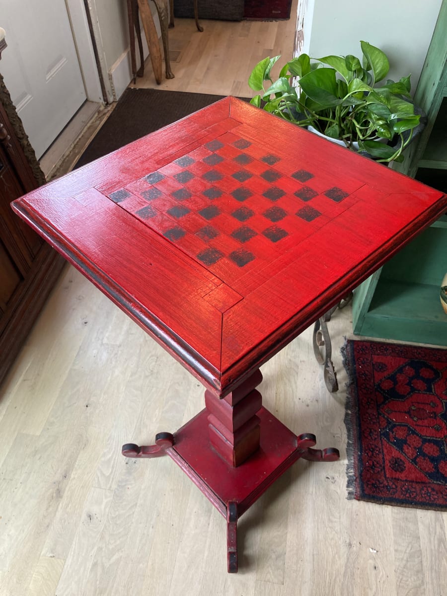 Primitive red painted chess table 