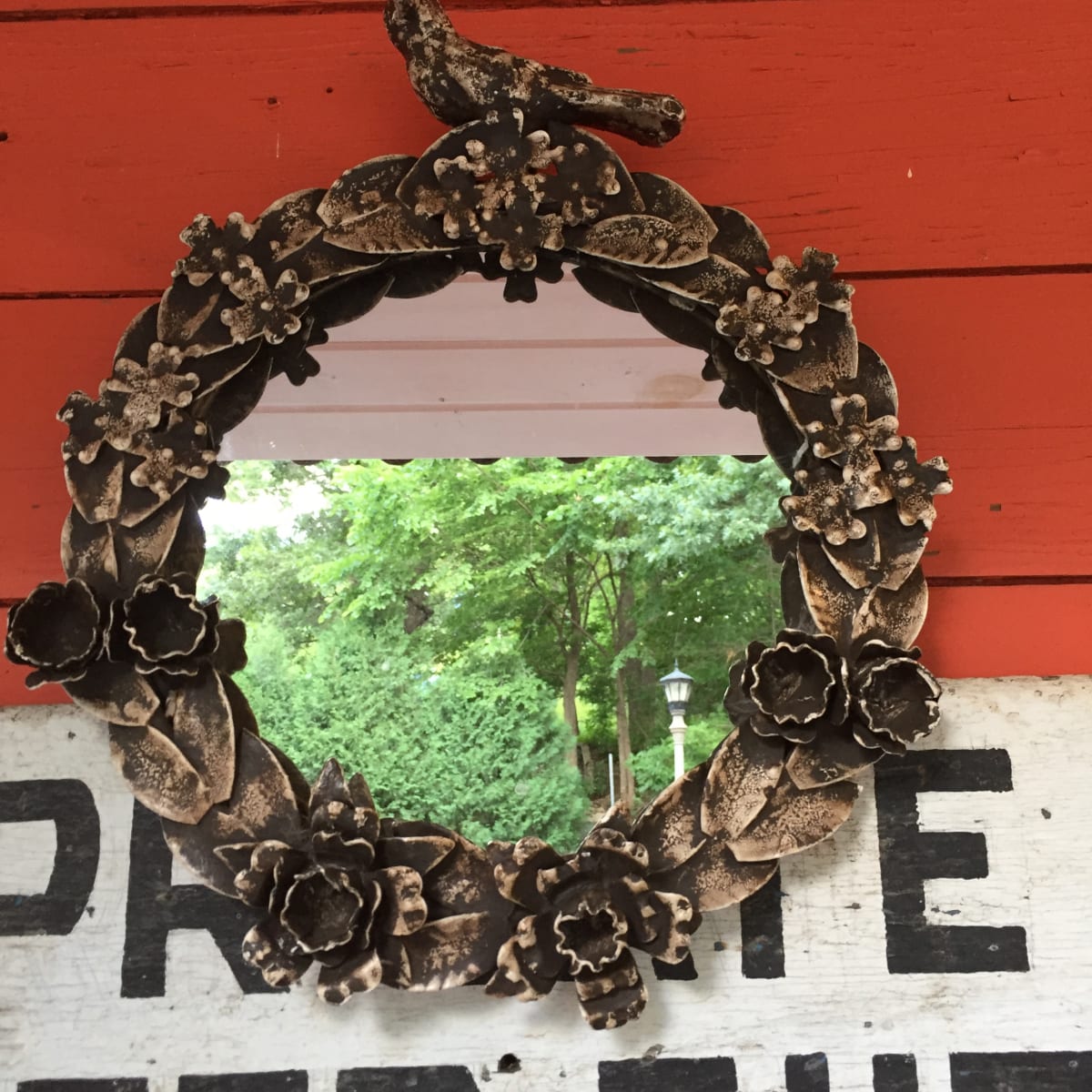 Framed iron bird motif round mirror 