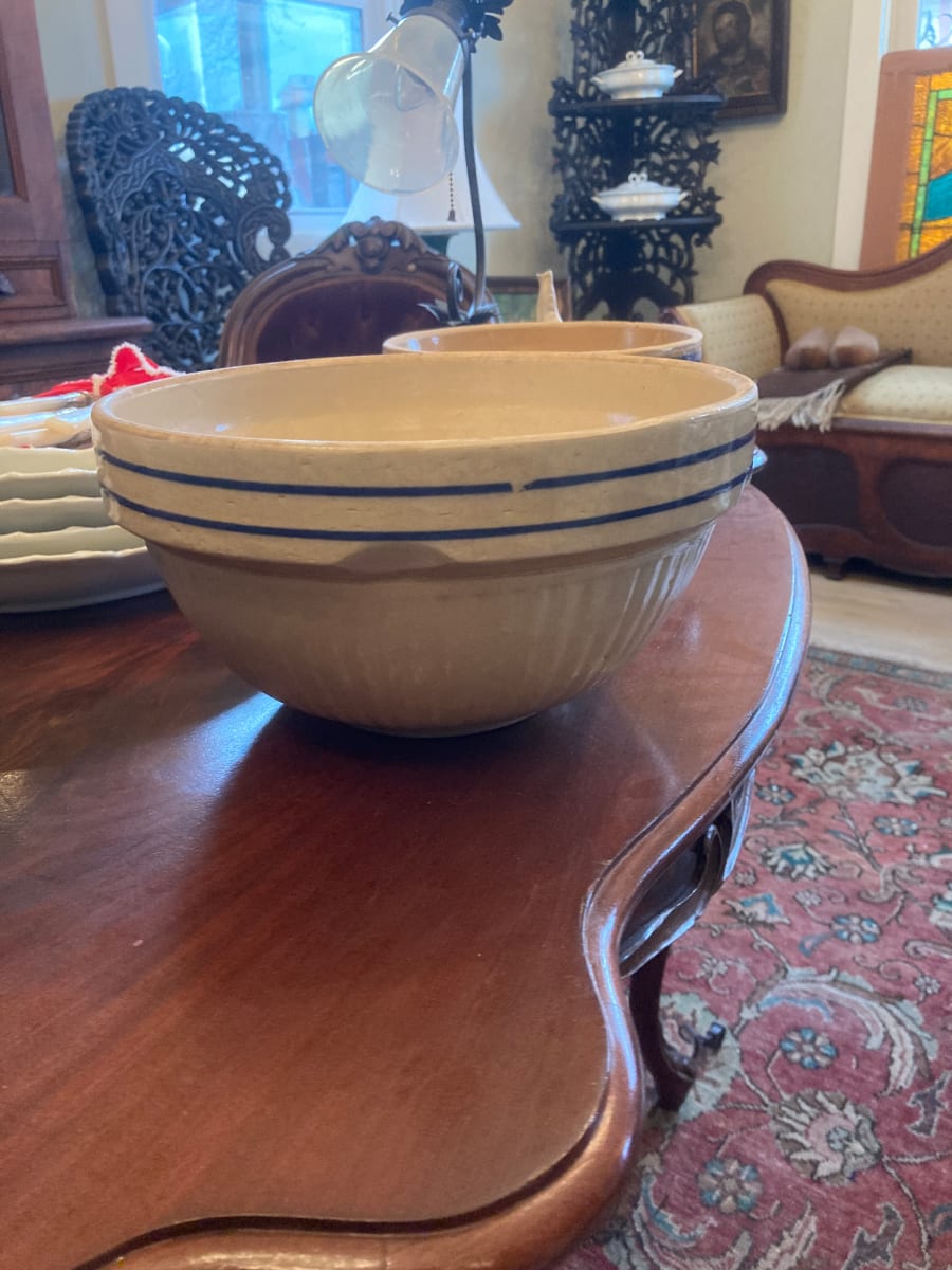 large vintage pottery mixing bowl with blue stripes 