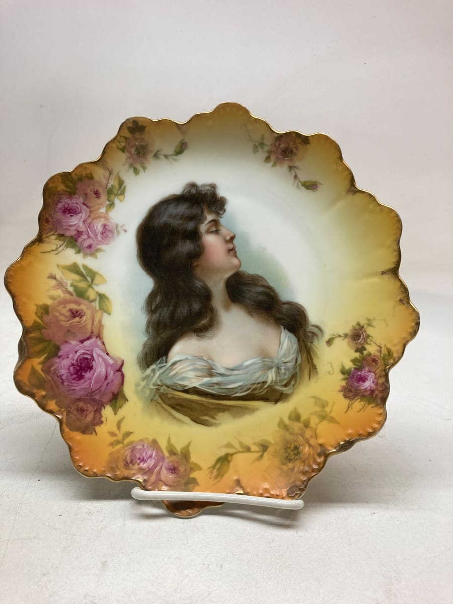 hand decorated porcelain figural and floral plate 