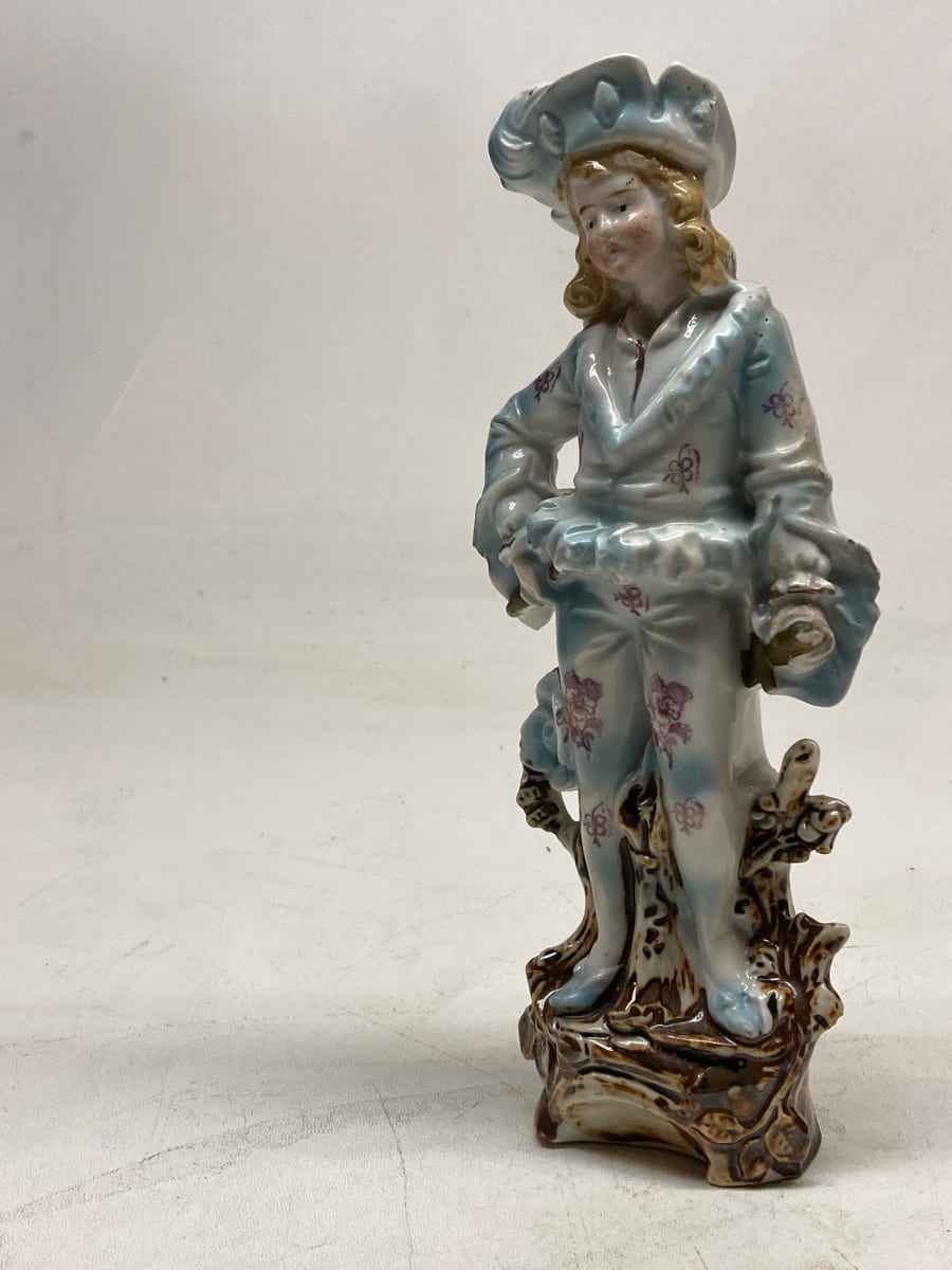 Soft paste German porcelain figure of boy in hat 