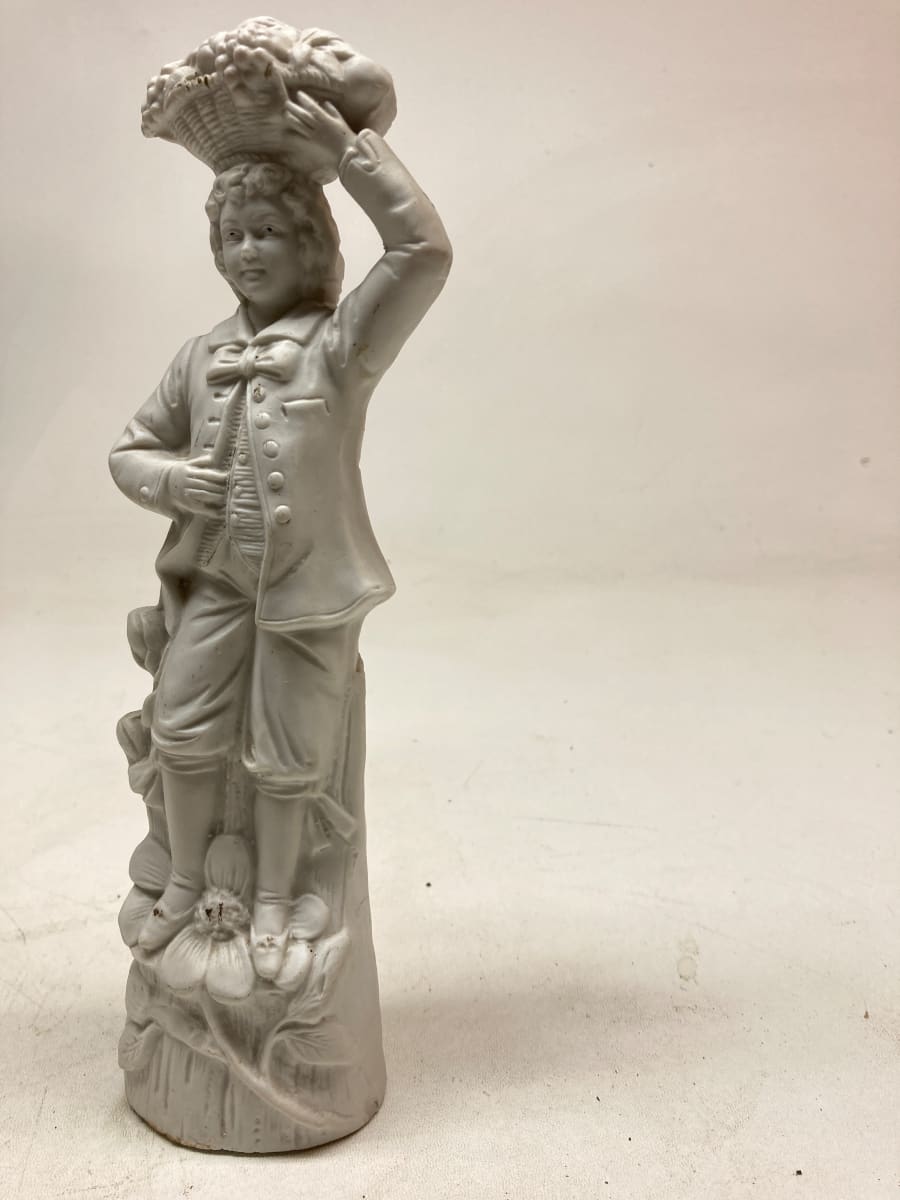 Porcelain parian boy figure with basket 