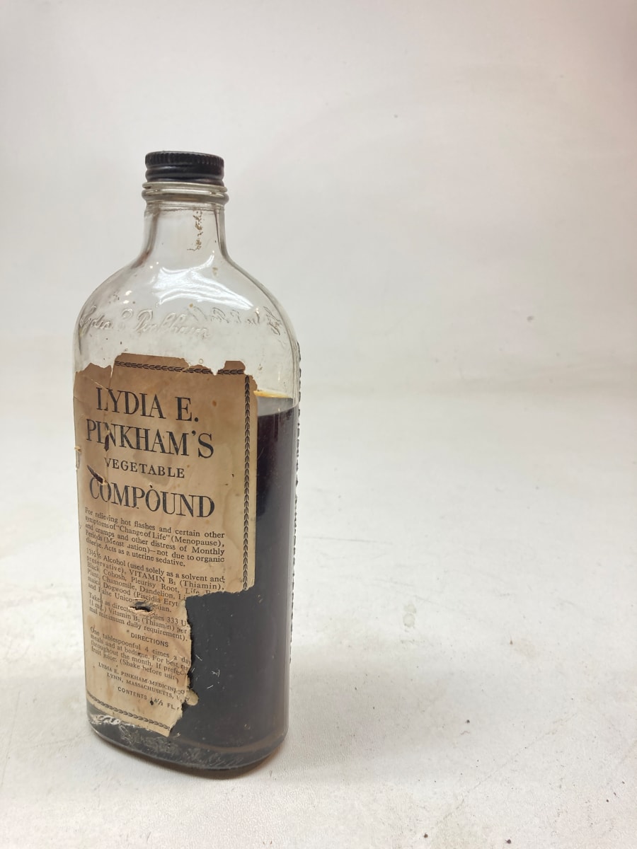 embossed vintage glass advertising lidded bottle 