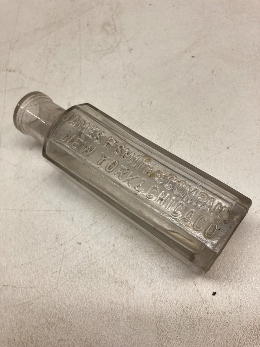 embossed vintage glass advertising bottle 