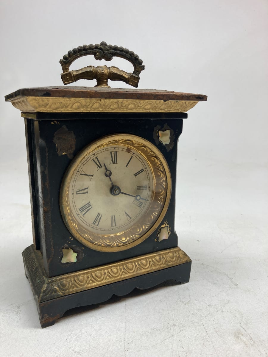 small cast iron turn of the century clock 